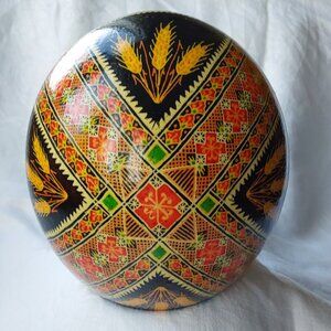 Traditional ukrainian Easter egg pysanka ostrich wheat folkart black red green